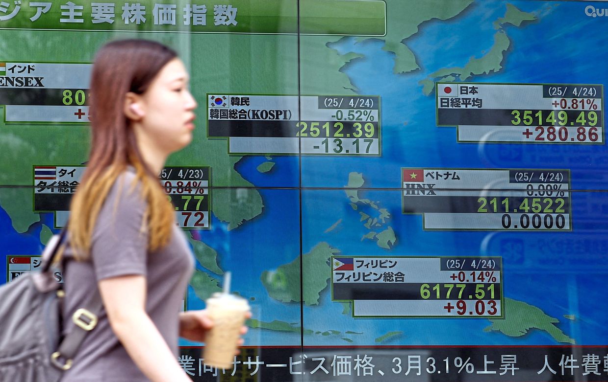 Asia shares slump as global tech selloff spooks investors, silver tumbles again