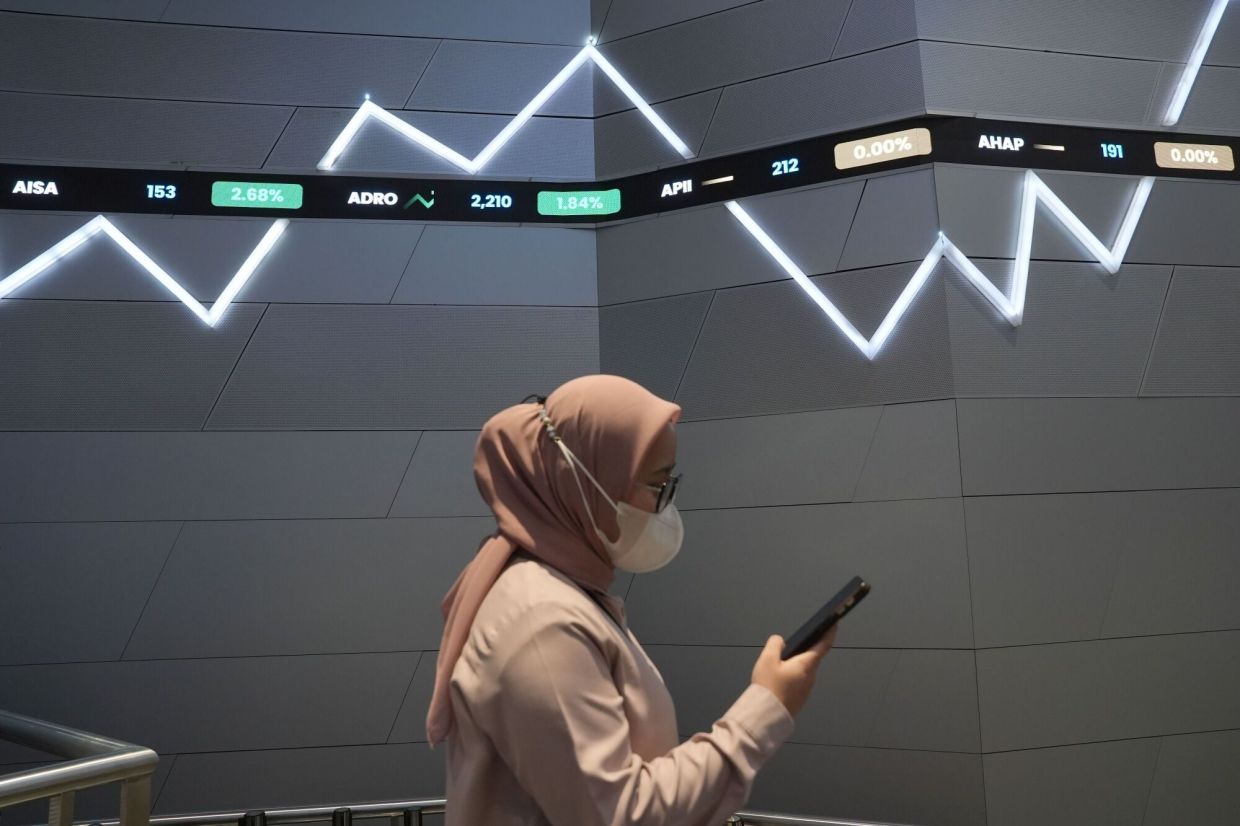 Oil prices surge, stocks skid in flight from risk