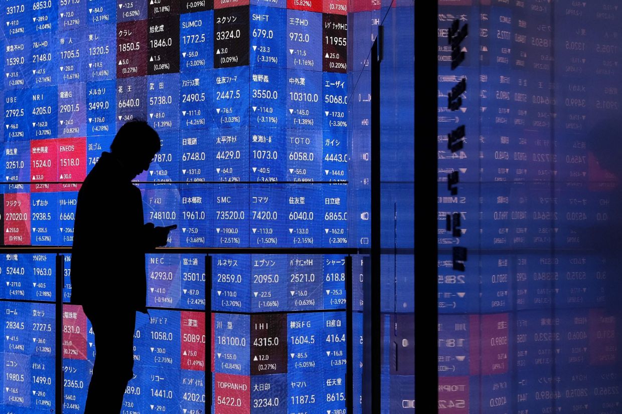 Japan traders gain but utilities hit by Iran war