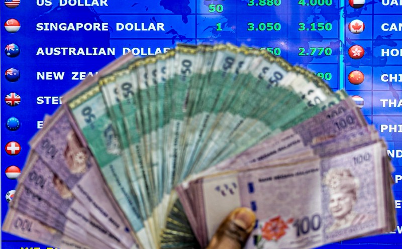 Ringgit breaks 3.90 vs dollar, hits eight-year high