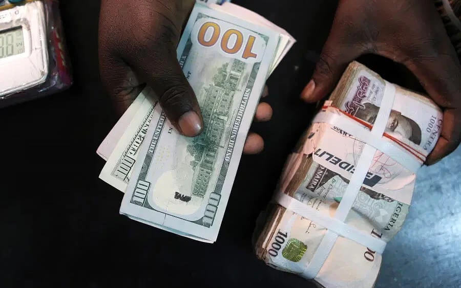 Naira holds firm despite mild dip as external reserves cross $50bn