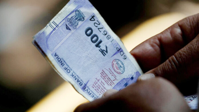 Rupee falls 14 paise to close at 90.70 against US dollar