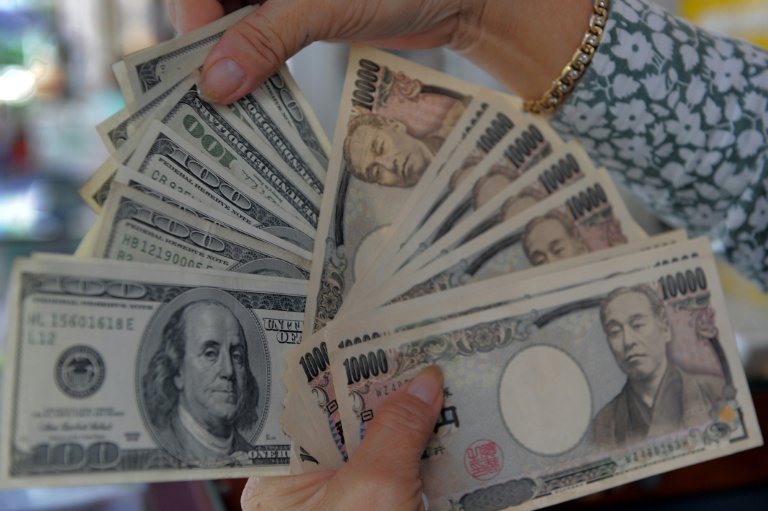 Dollar sinks on yen intervention talk, gold breaks $5,000