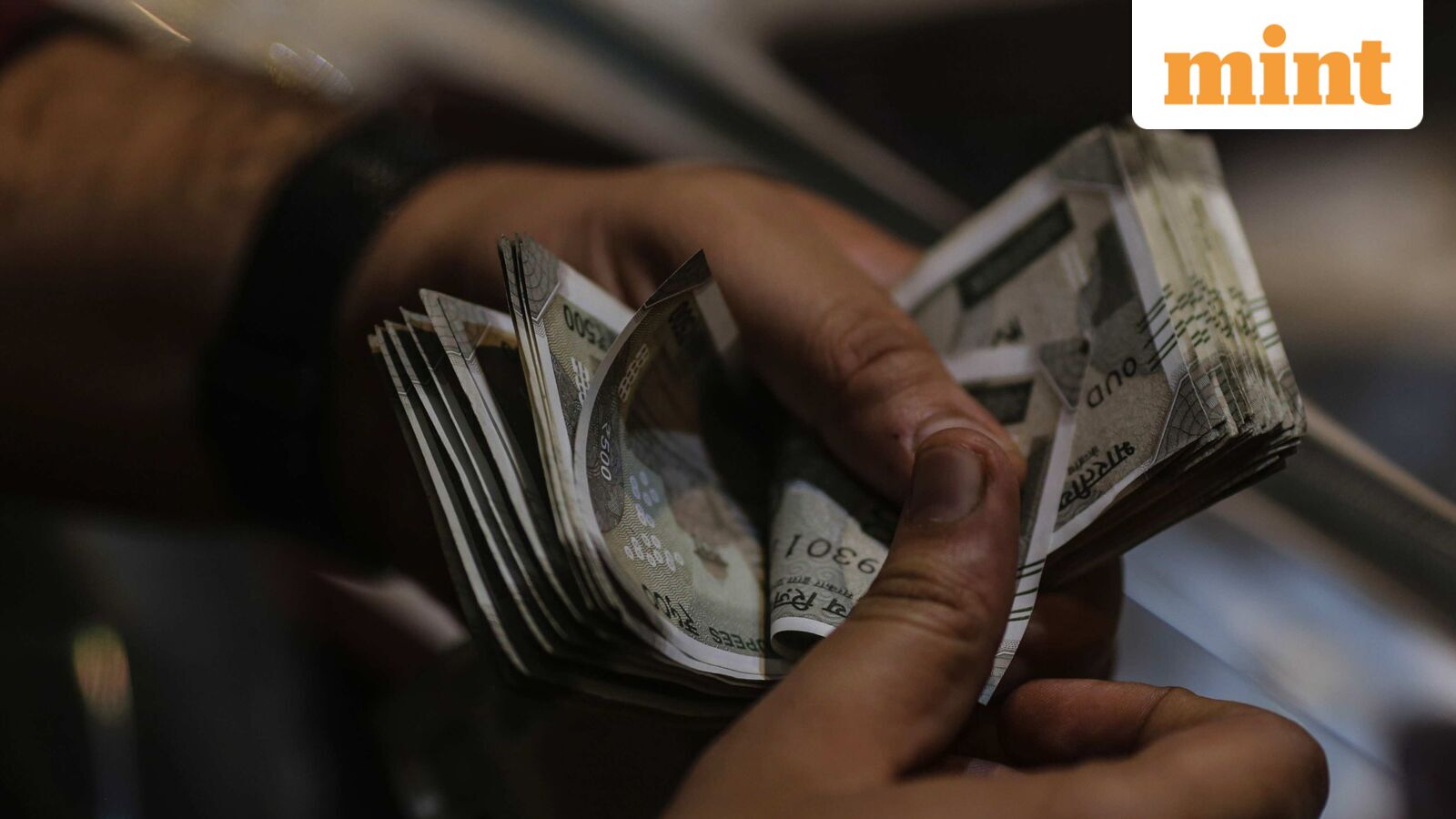 Rupee rebounds from record low of 92.02 to end marginally higher against US dollar