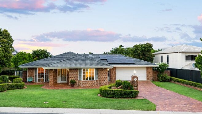 House prices surge as intense buyer competition grips Brisbane auction market